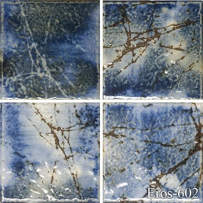 Four blue-gray marbled tile samples with brown veining and a glossy finish