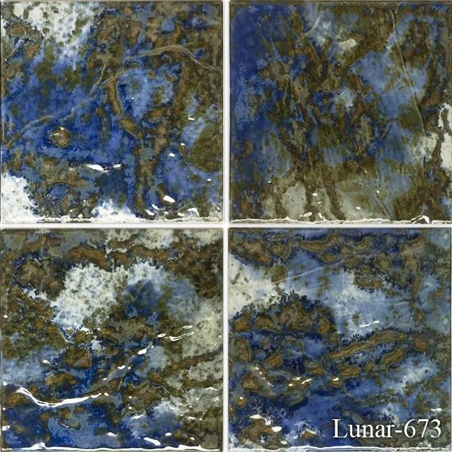 Four blue-gray abstract panels with mottled textures, divided by white lines; “Lunar-673” in the lower right.