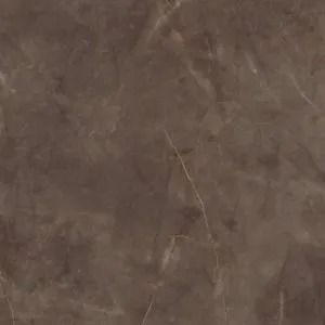 Close-up of a brown, textured surface with faint scratches and marks.