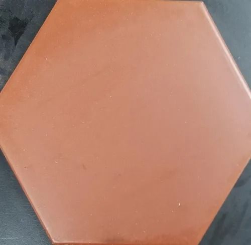 Orange hexagonal tile on a dark gray background