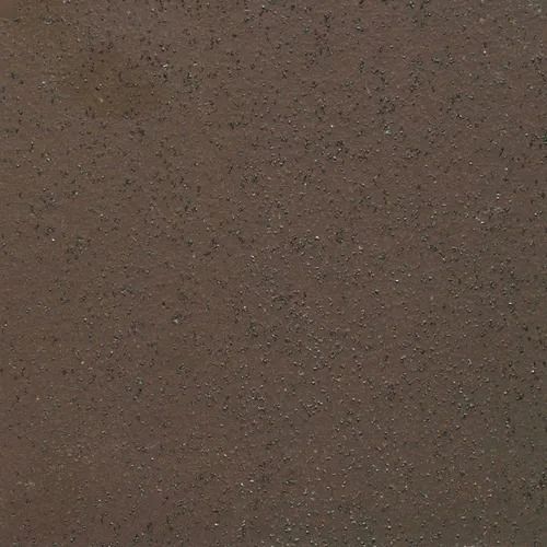 Close-up of a brown, speckled textured surface.