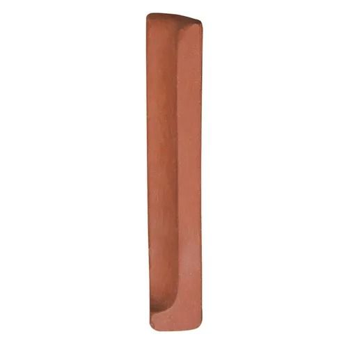 Tall narrow terracotta-colored rectangular ceramic planter on a white background