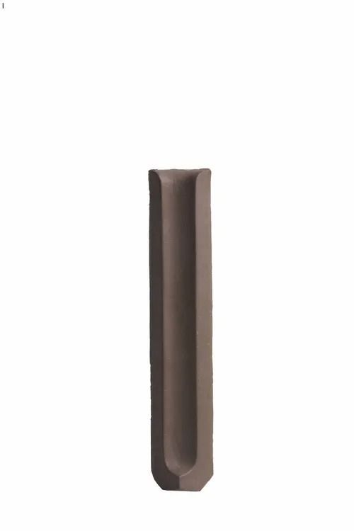 Dark brown cylindrical object with a hollow center on a white background