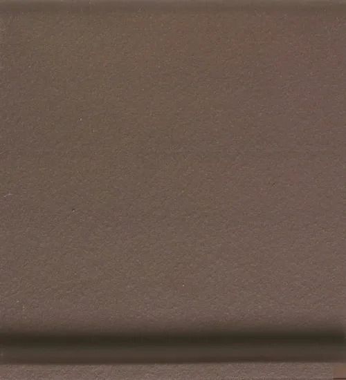 Blank brown wall with a dark horizontal strip near the bottom.