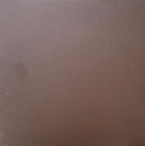 A blurry brown surface with no distinct objects or features visible.