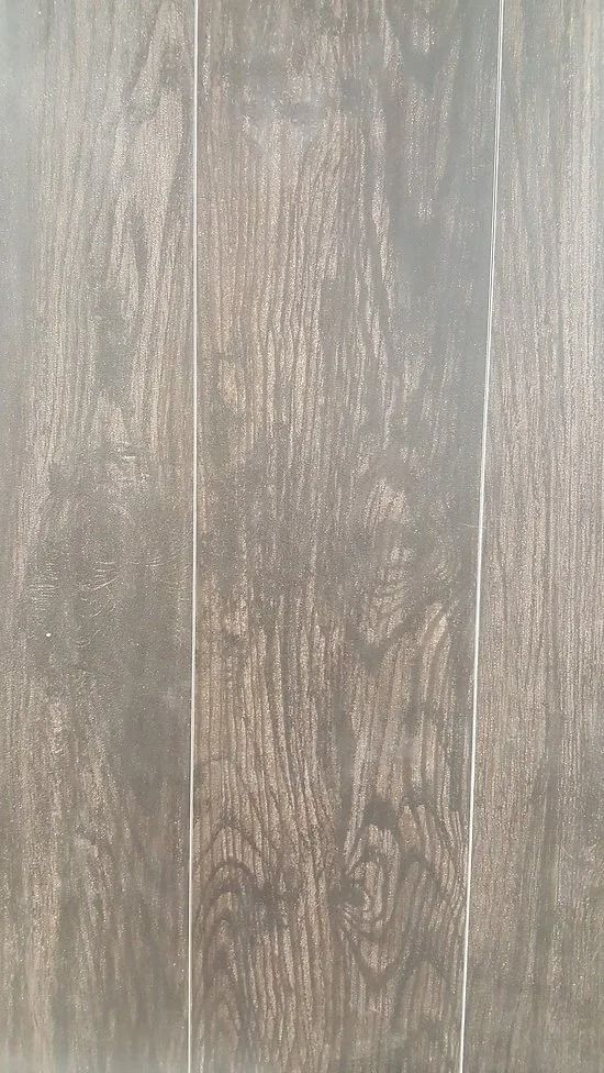Gray-brown weathered wood planks with visible grain and vertical seams