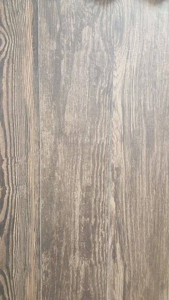 Wood-grain surface in gray-brown tones with vertical texture lines