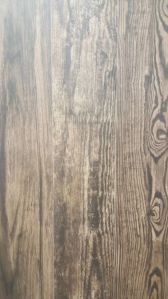 Light brown wood grain surface with vertical plank patterns