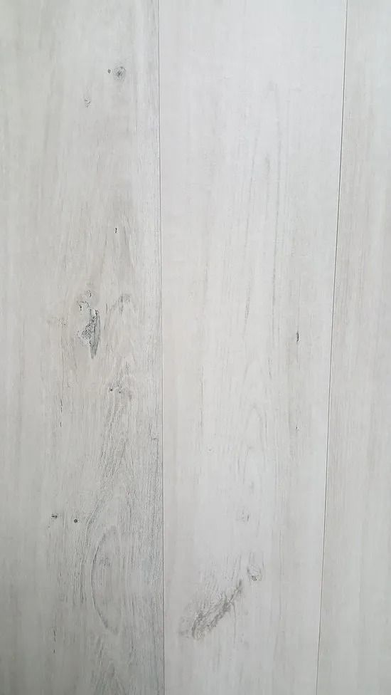 Light gray wood-grain surface with subtle vertical streaks and knots