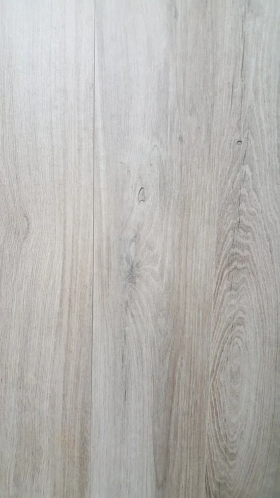 Light gray wood plank flooring with subtle grain texture and vertical seams