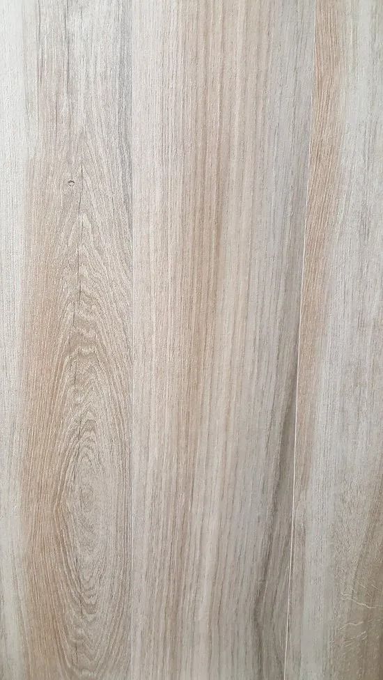 Light beige wood grain surface with vertical streaks and subtle texture