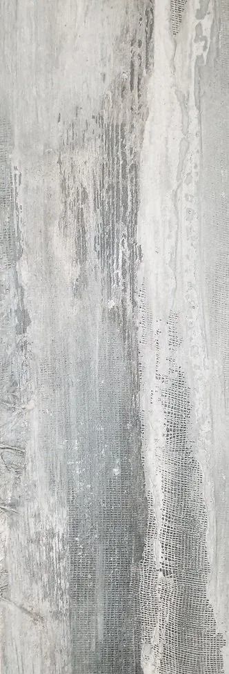 Gray-and-white textured wall with vertical streaks and weathered paint-like patterns