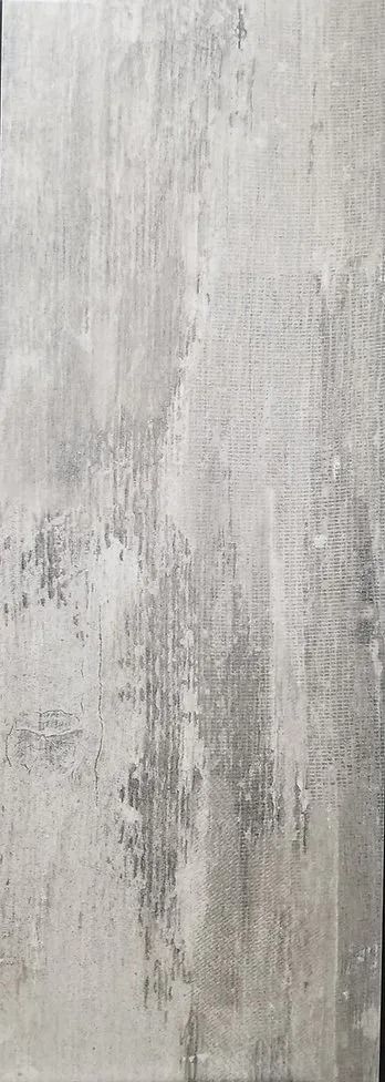 Gray textured concrete wall with subtle vertical streaks and weathered marks