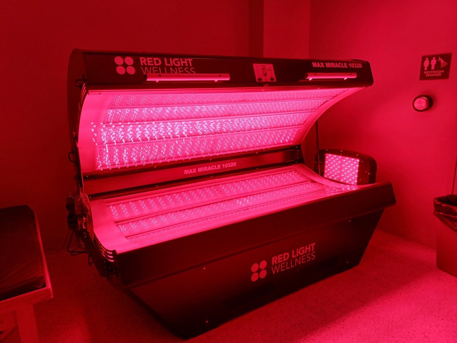 A Max Miracle 9600 red light therapy bed lit up