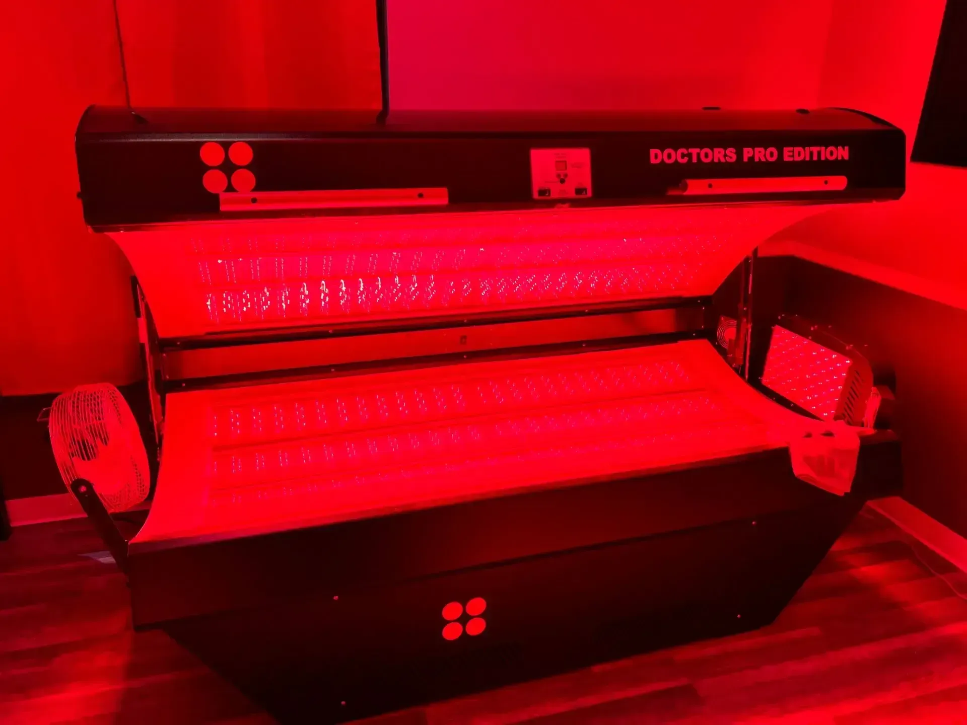 A Max Miracle 9600 red light therapy bed lit up