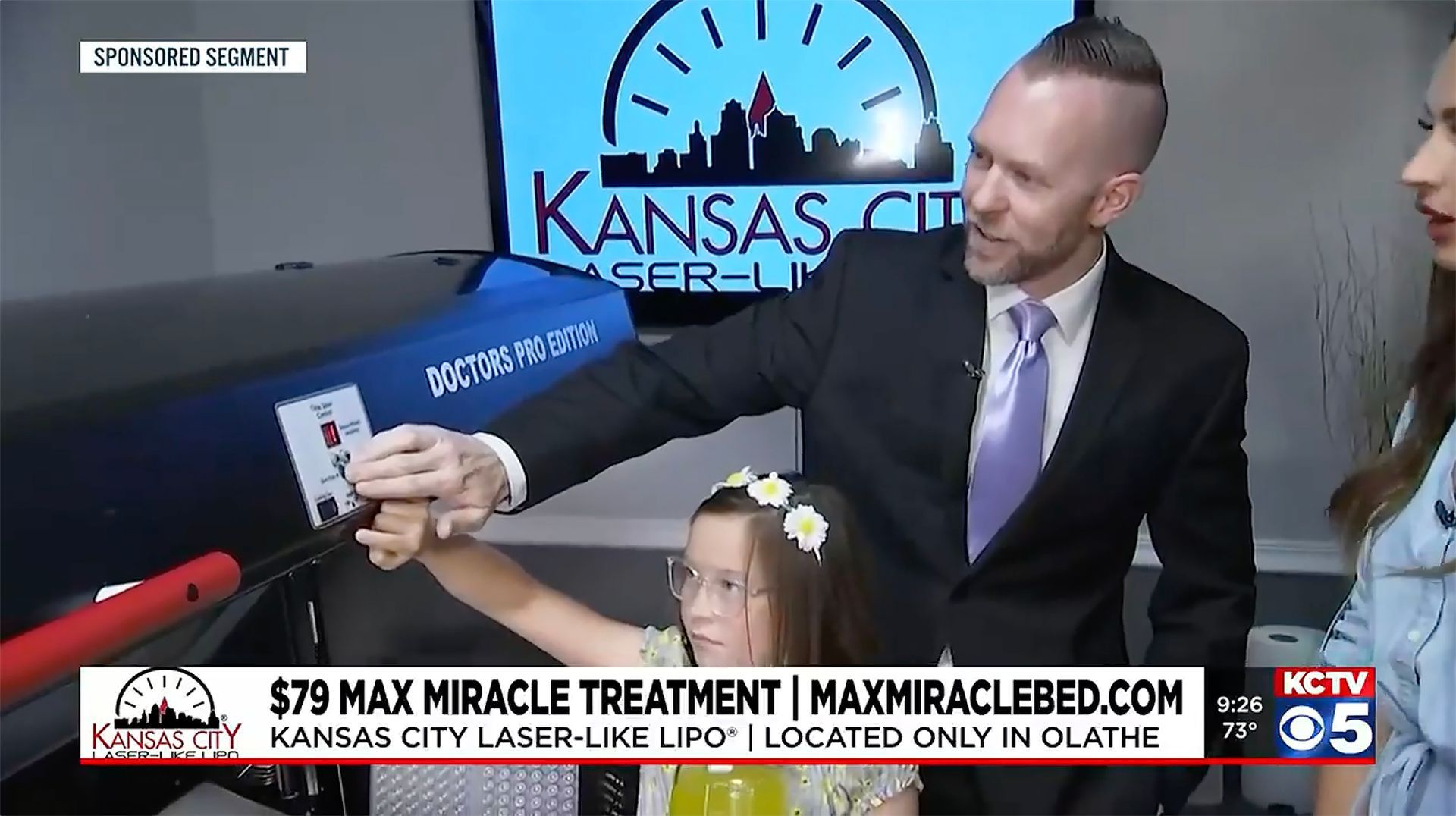 Dr. Jeremy Landry, D.C. and his daughter demonstrating the Max Miracle Bed on TV