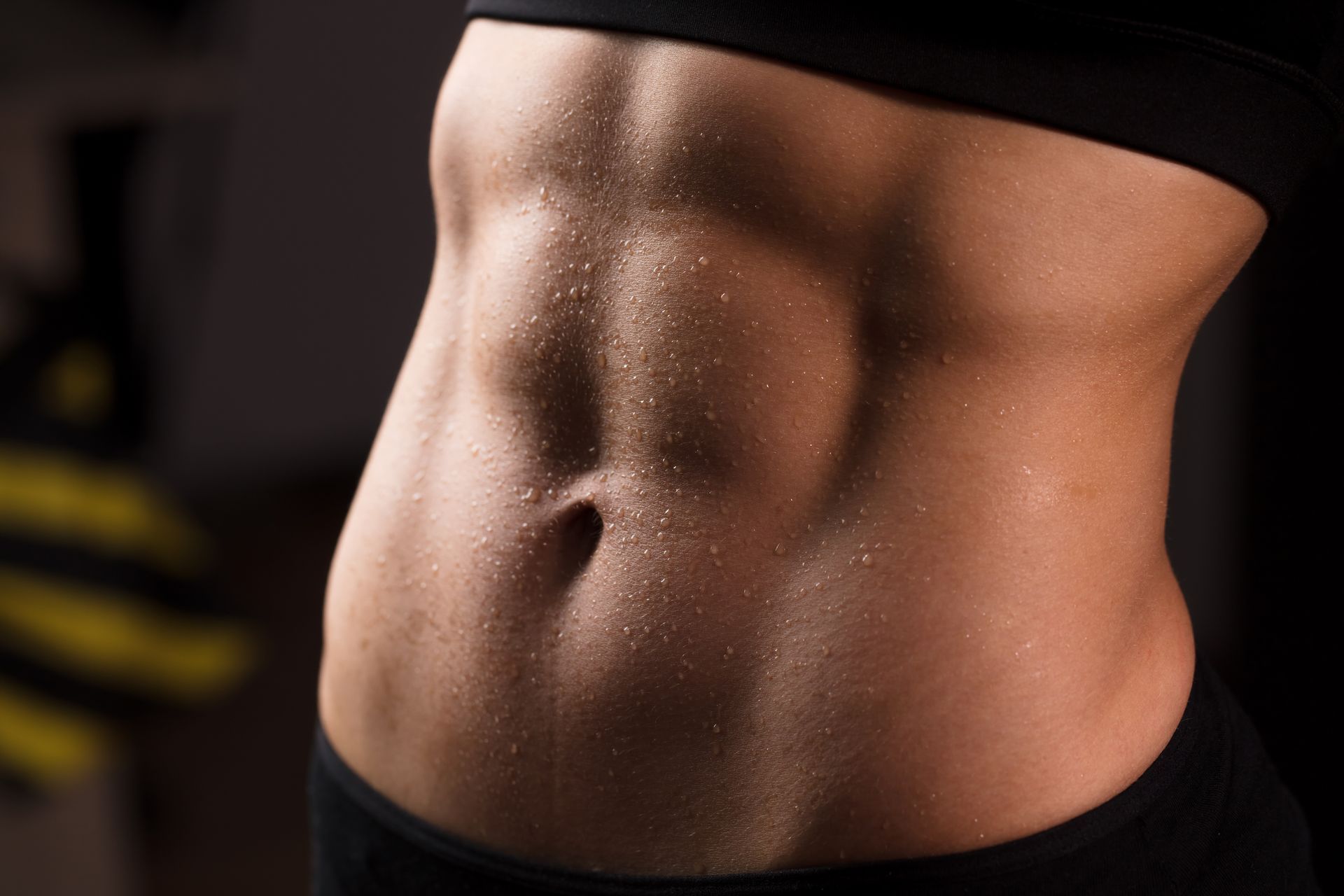 A picture of a woman's flat stomach with abs