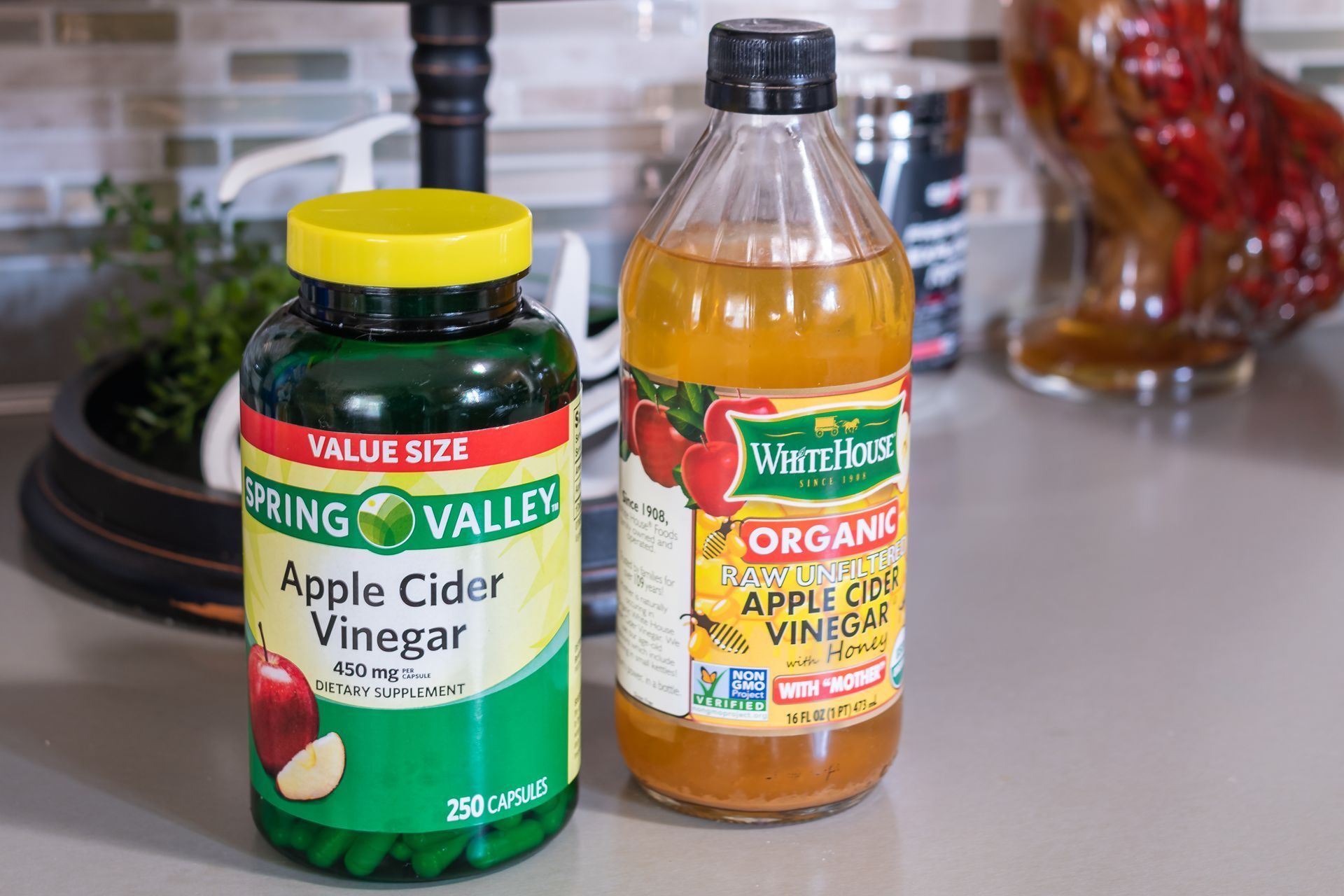 Two glass jars of apple cider vinegar