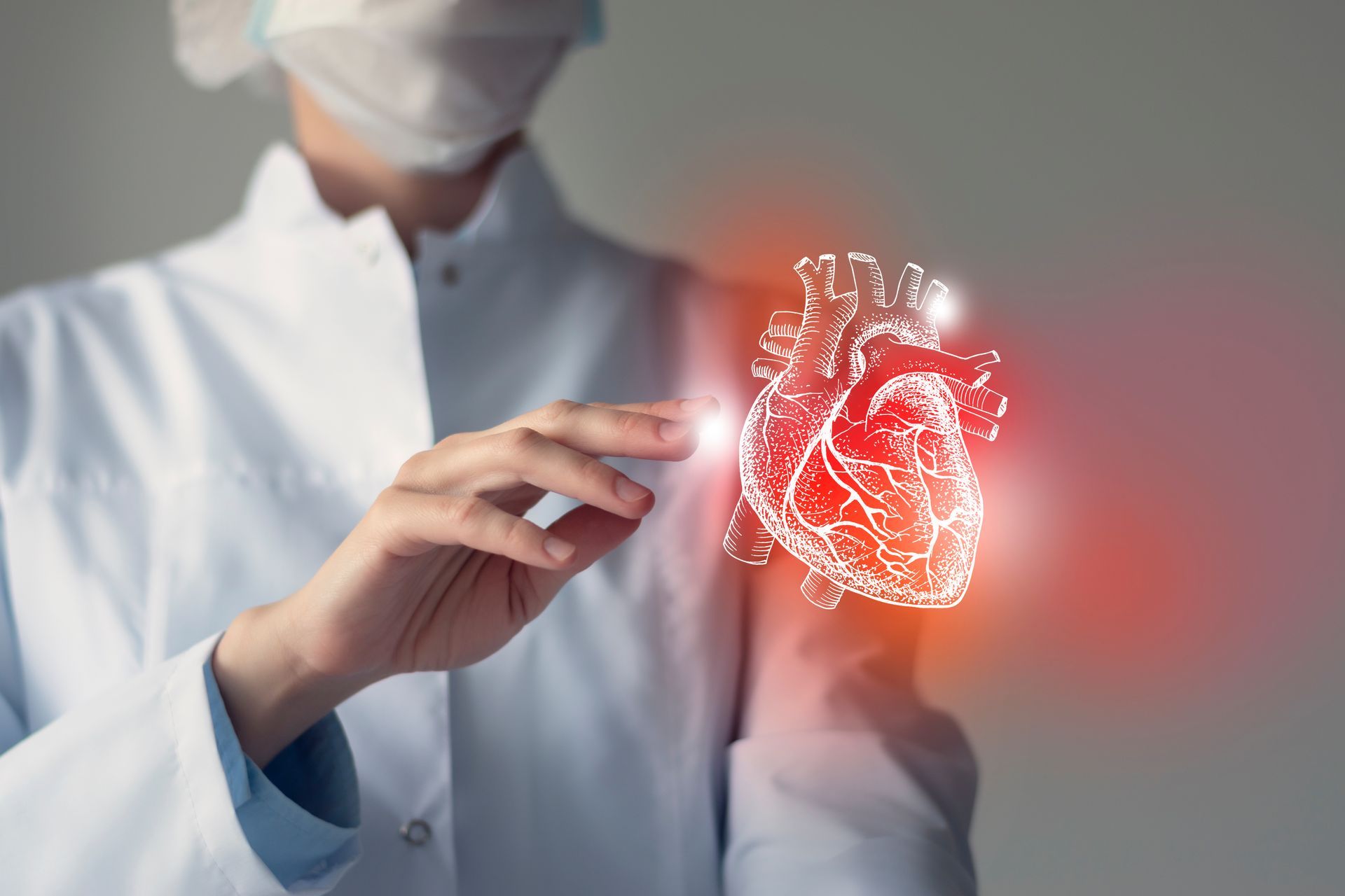 A graphic of a human heart and a doctor in a white lab coat.