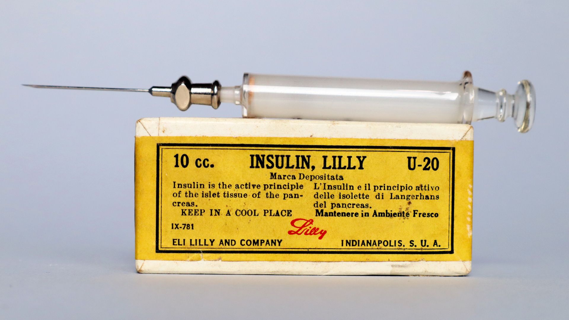 An old insulin syringe and a old insulin box