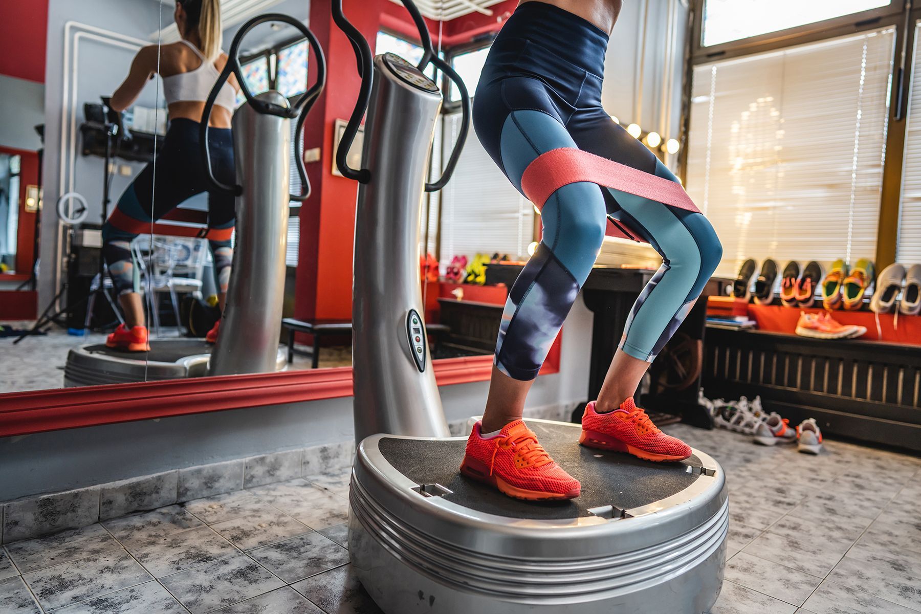 A woman on a whole body vibration platform