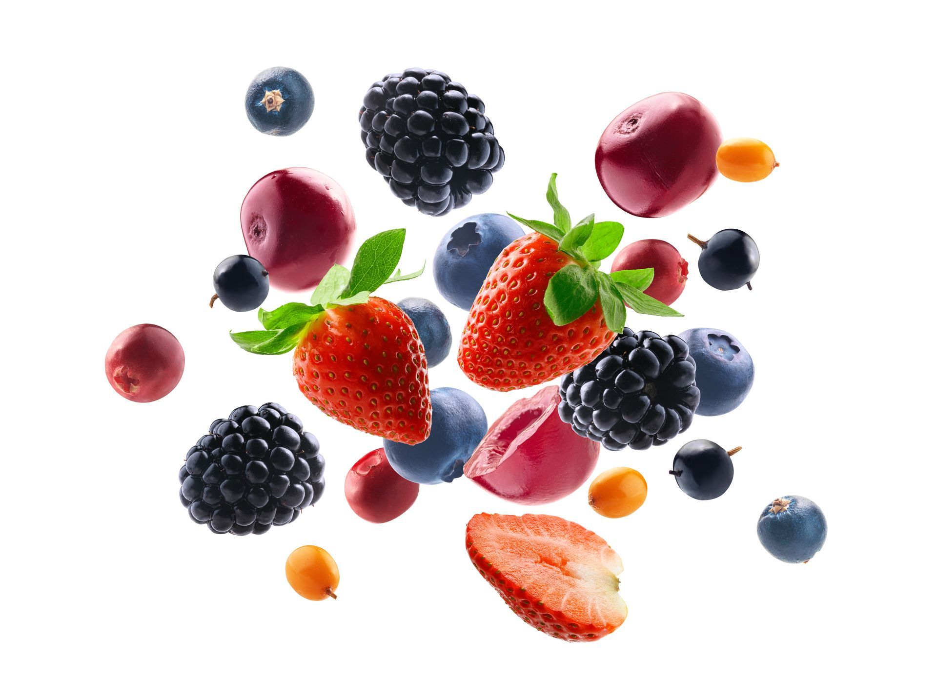 A photo of strawberries, blue berries, and black berries all mixed together