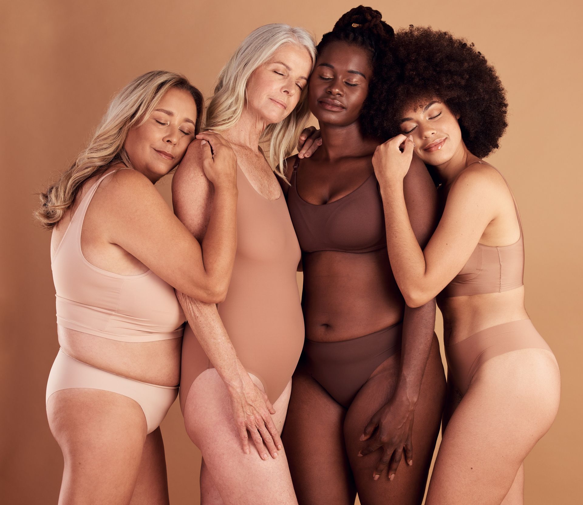 A picture of 4 women laughing together