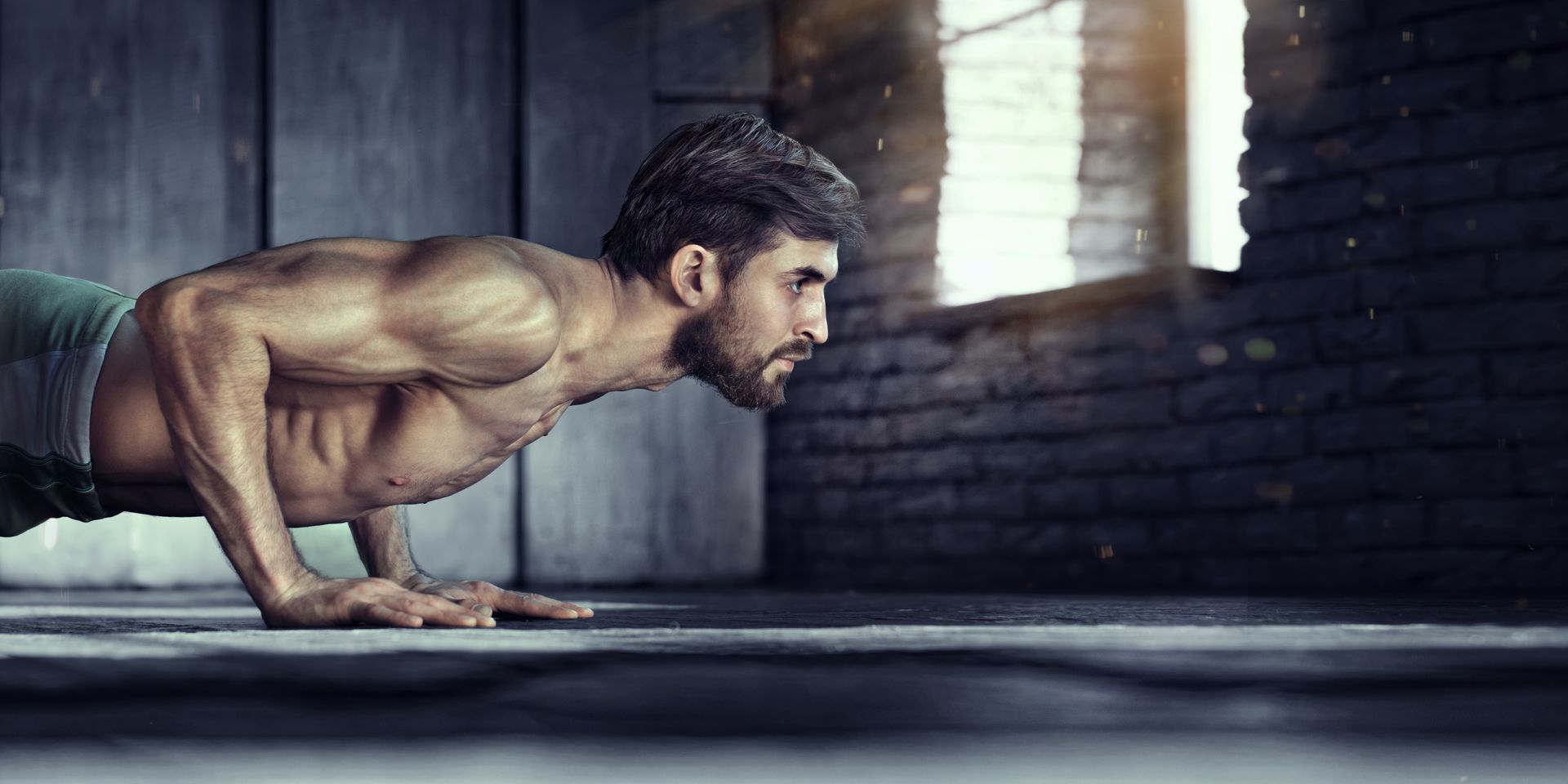 A white man doing pushups on the floor