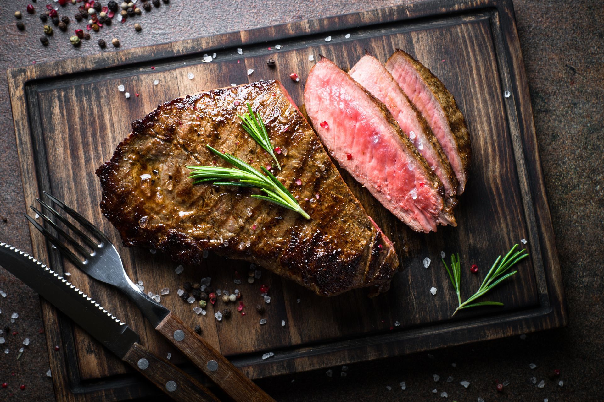 Cooked steak on a wooden cutting board