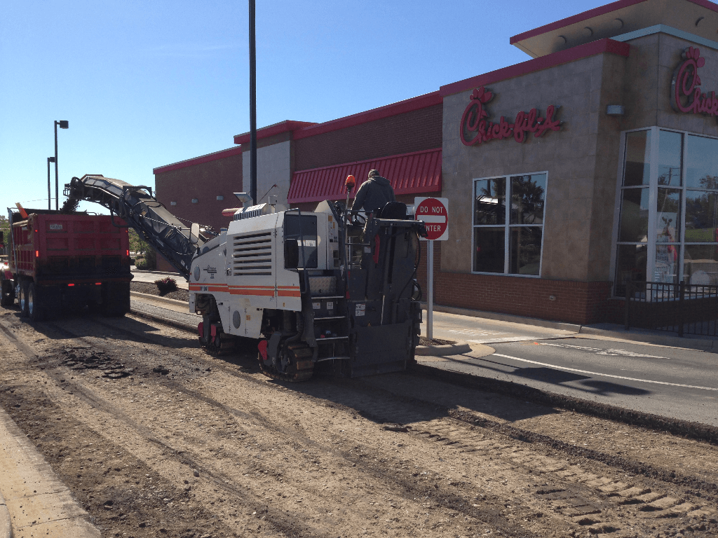 Full depth milling around concrete curb and gutter