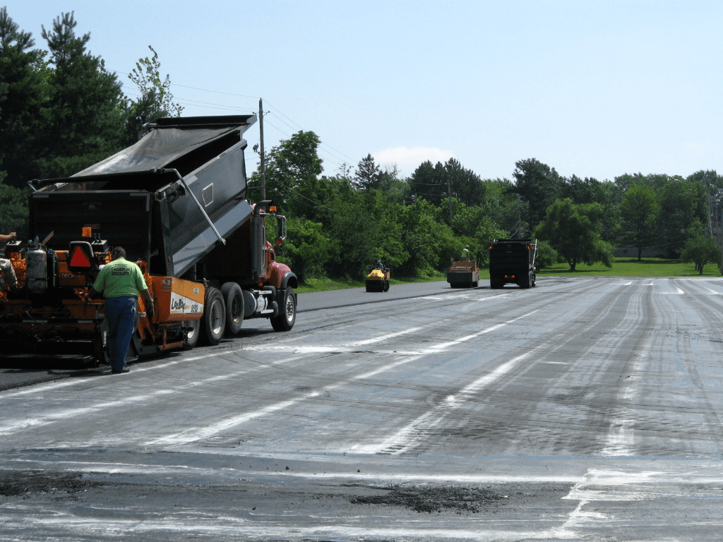 Surface course installed over asphalt fabric
