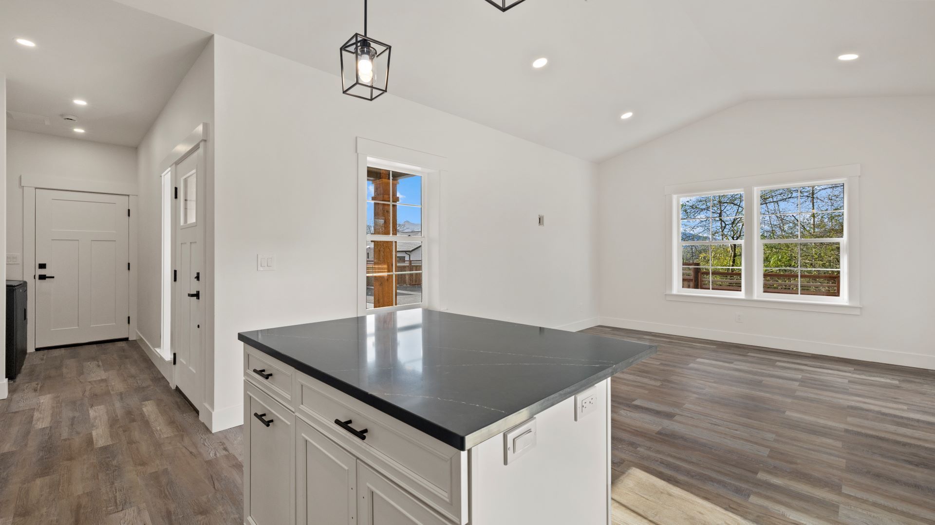 A kitchen with a large island in the middle of the room.