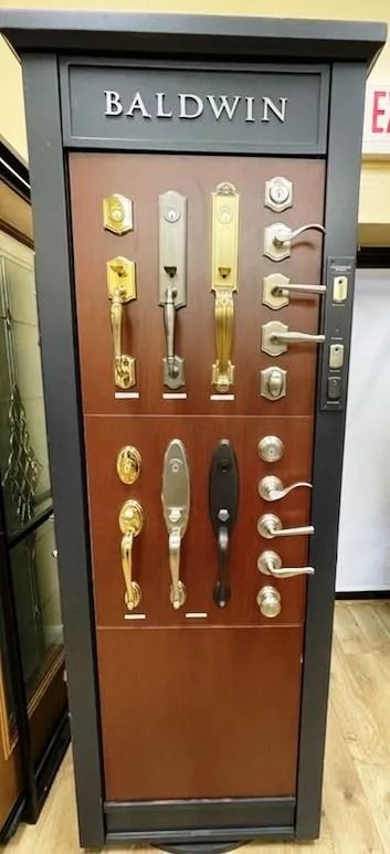 Display case featuring Baldwin door hardware in a store.