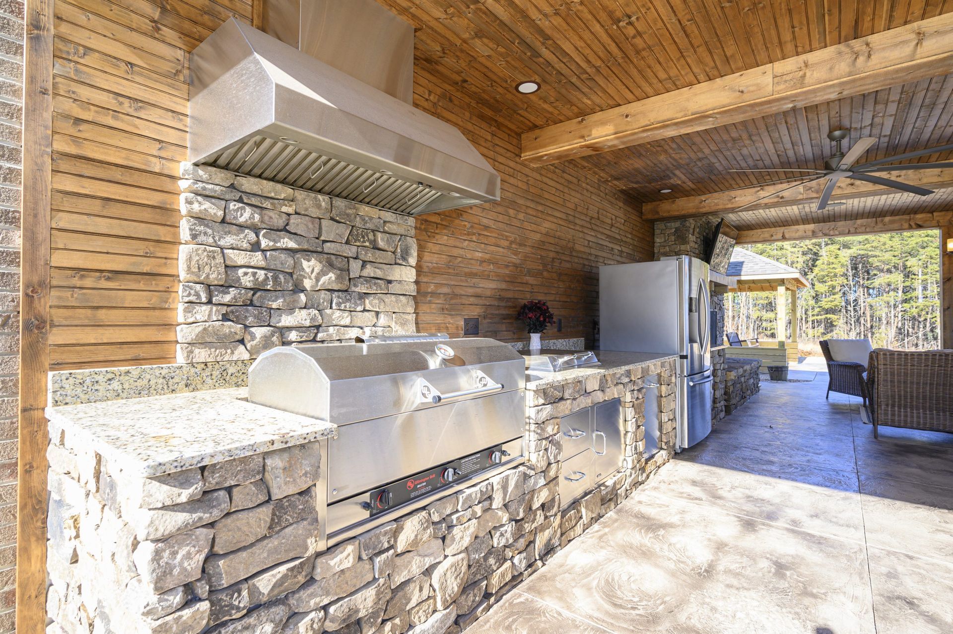 Furnish patio and outdoor kitchen