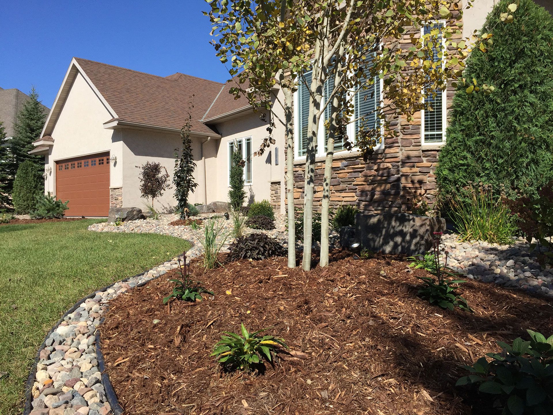 mulch and stones around the landscaping