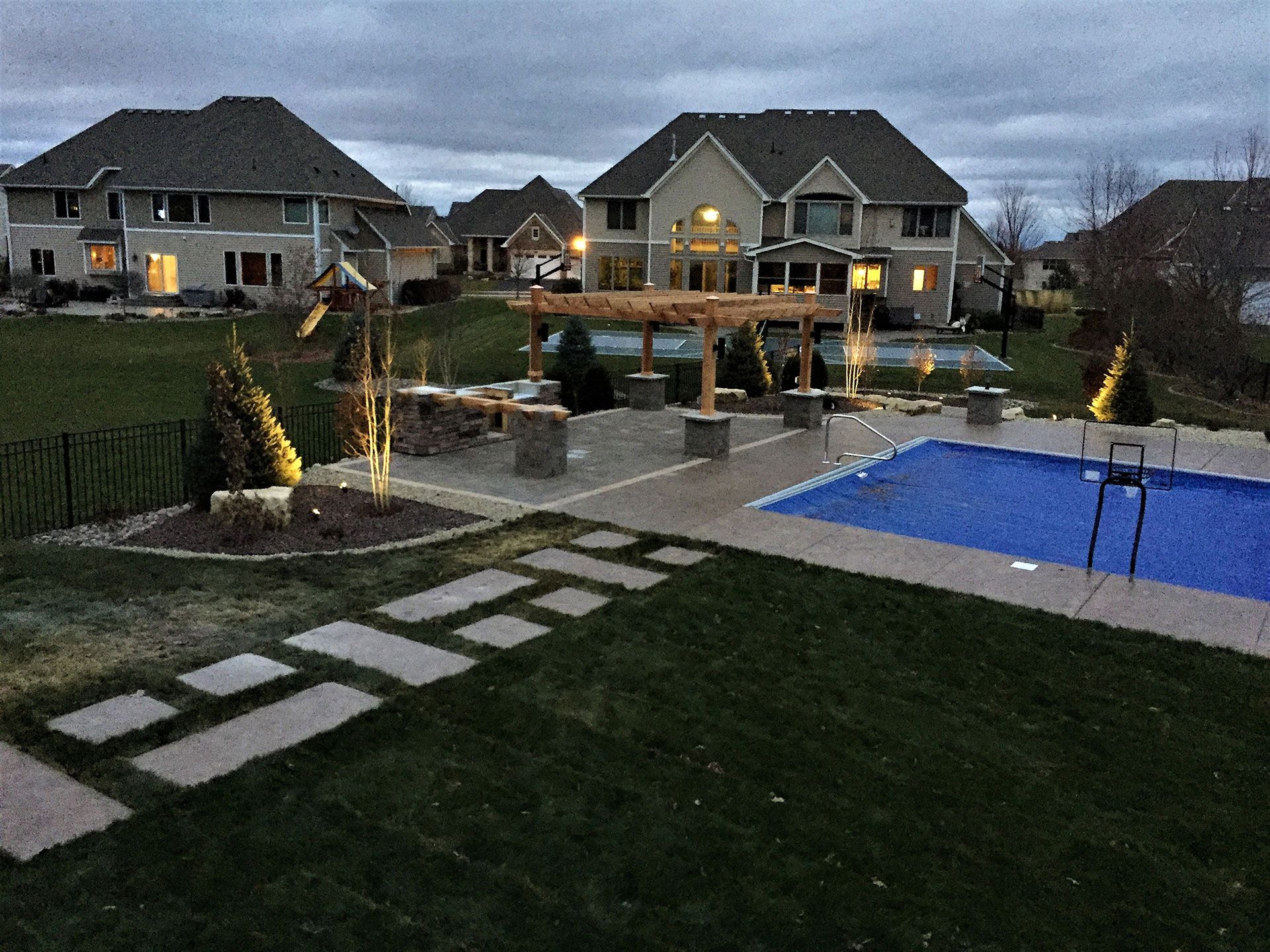 landscaping and hardscaping by the swimming pool