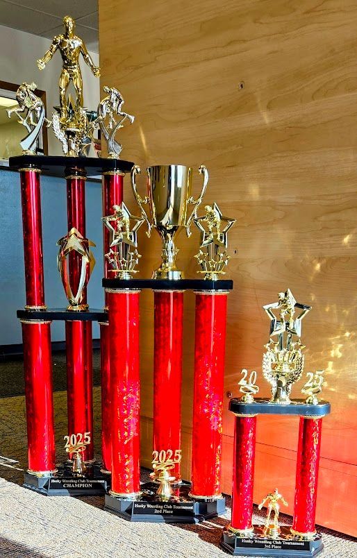 A row of red trophies with the year 2005 on them