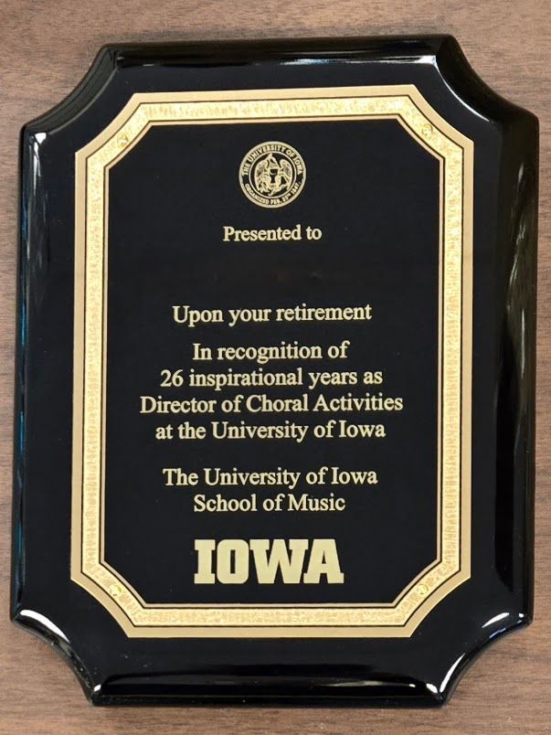 A black and gold plaque that says iowa on it
