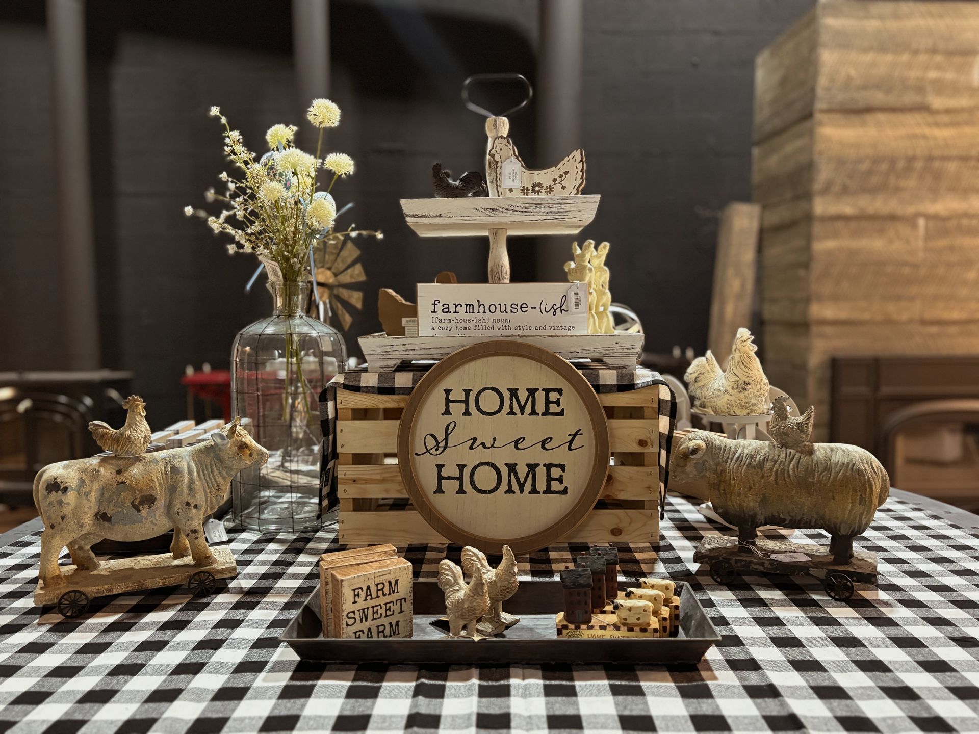 A display of wooden crates in a room with fireplace mantels.