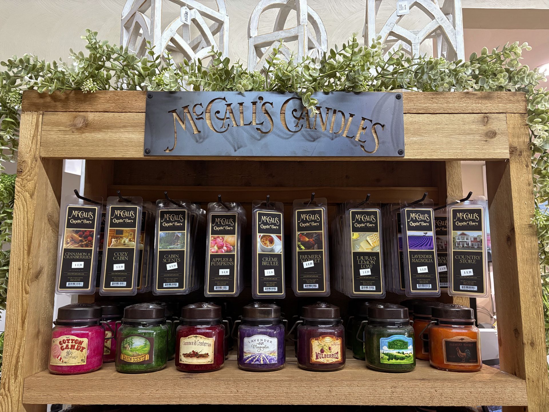 A mantle with a wreath and a windmill on it