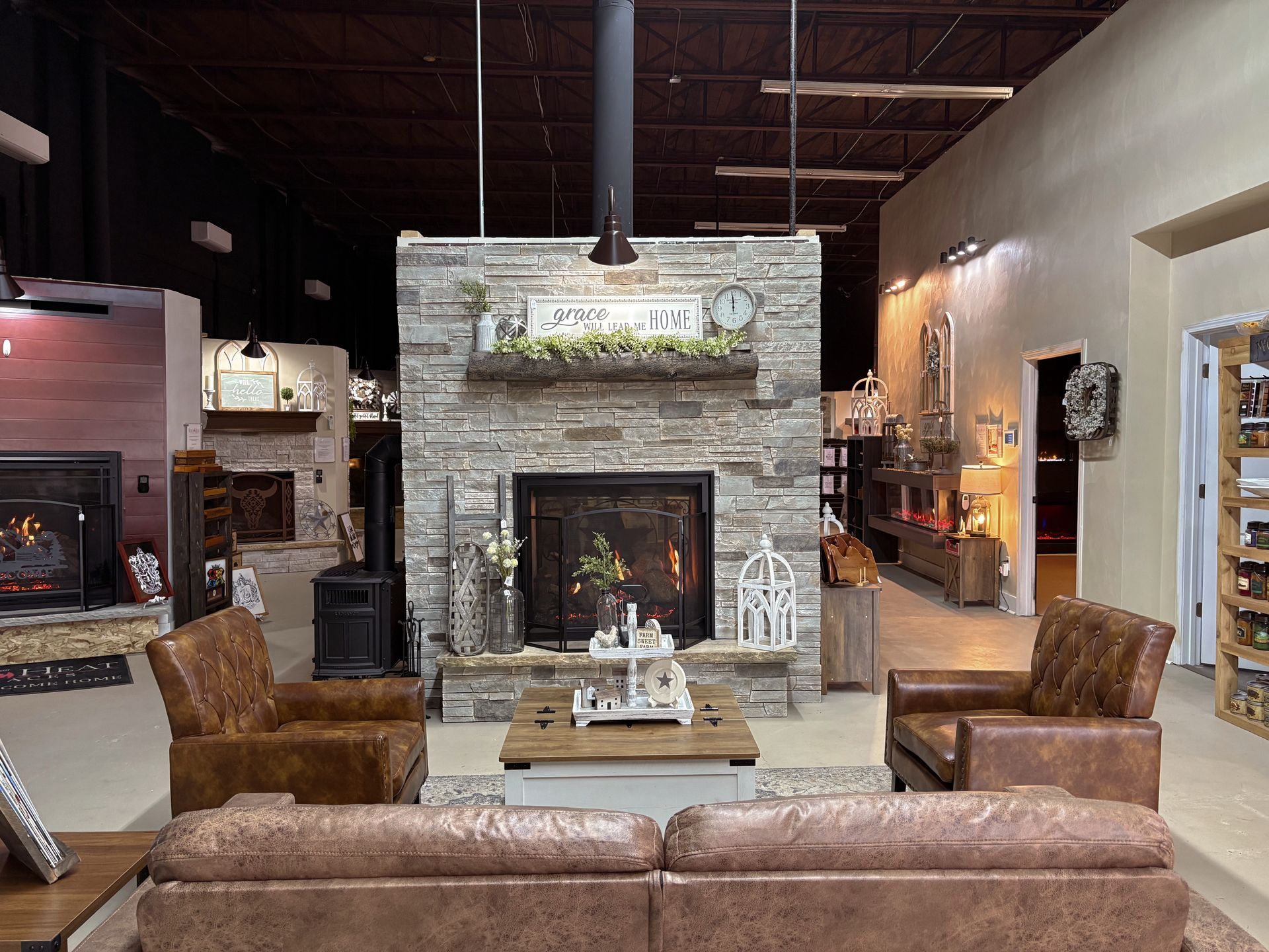 A living room filled with furniture and a fireplace.