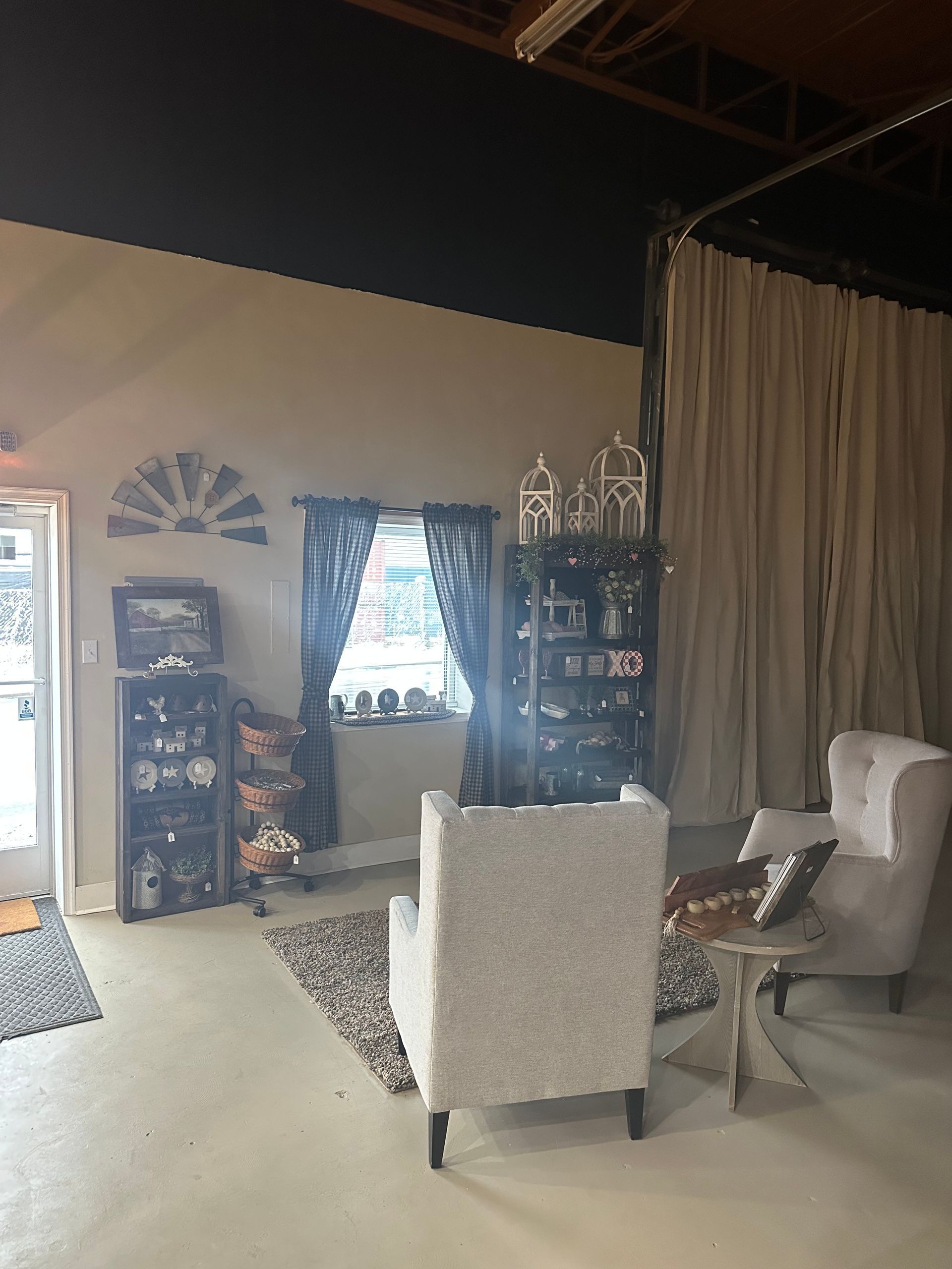 A living room with two chairs and a table