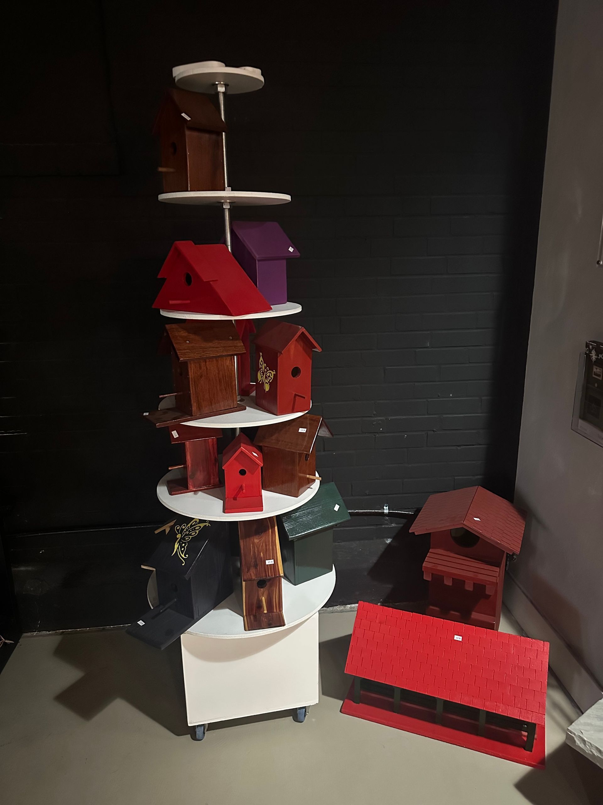 A bunch of bird houses are stacked on top of each other