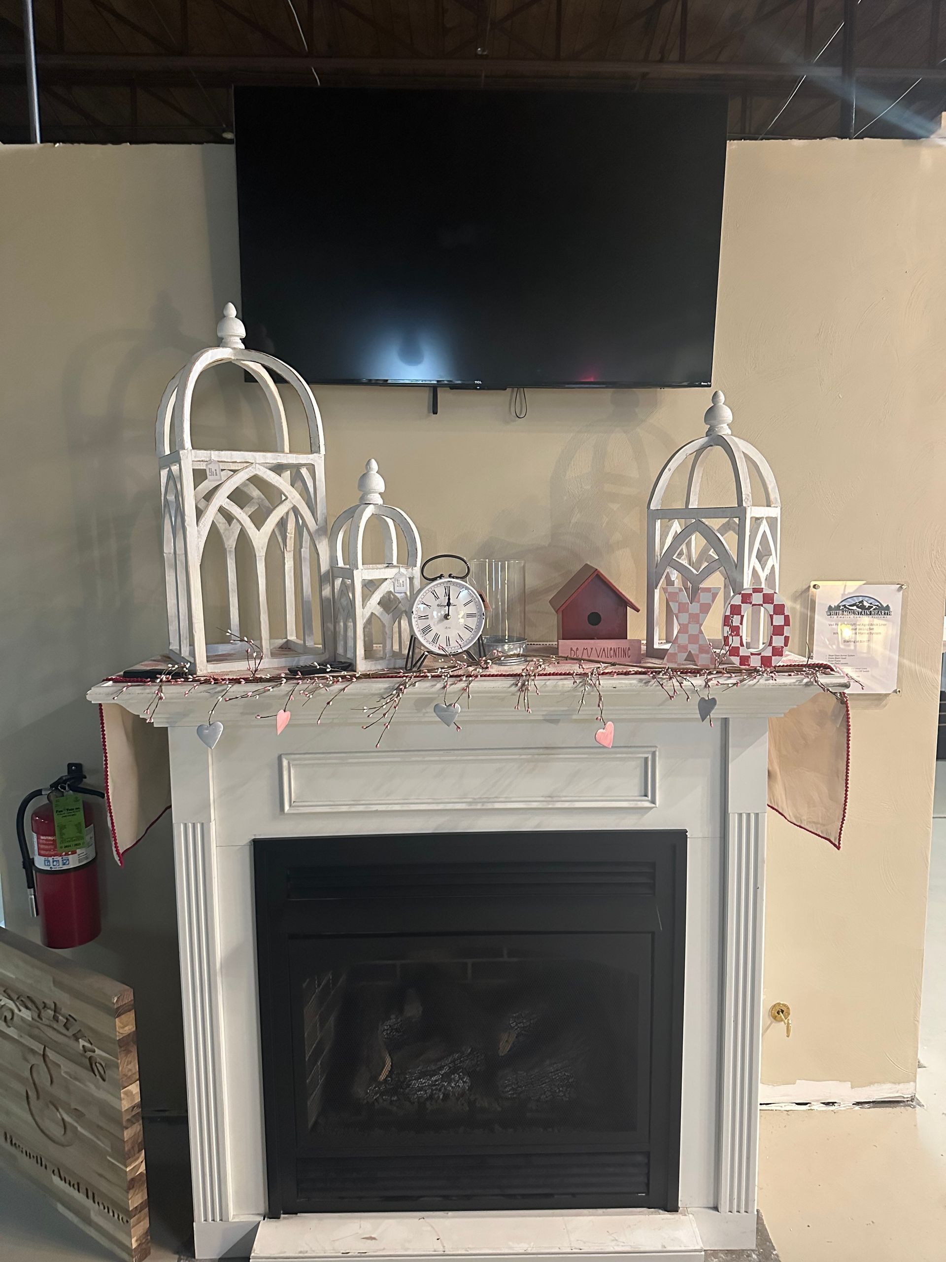 A fireplace with a flat screen tv above it