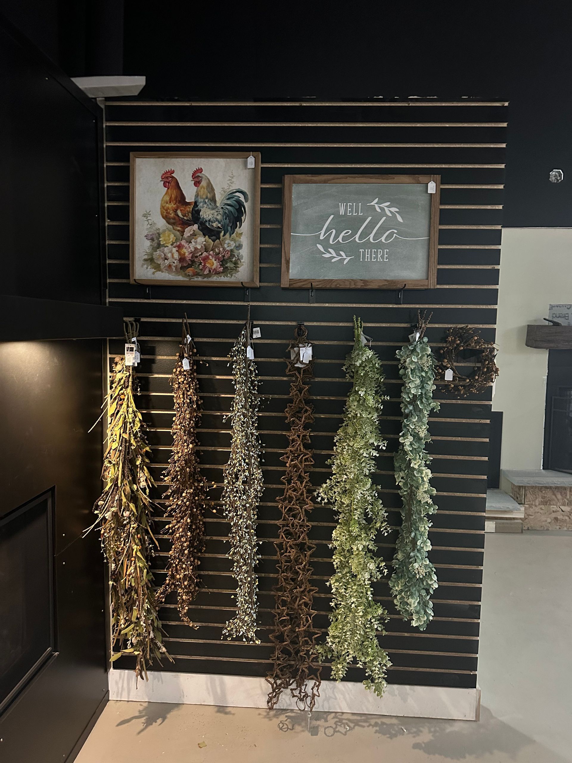 A wall with a bunch of garlands hanging on it.