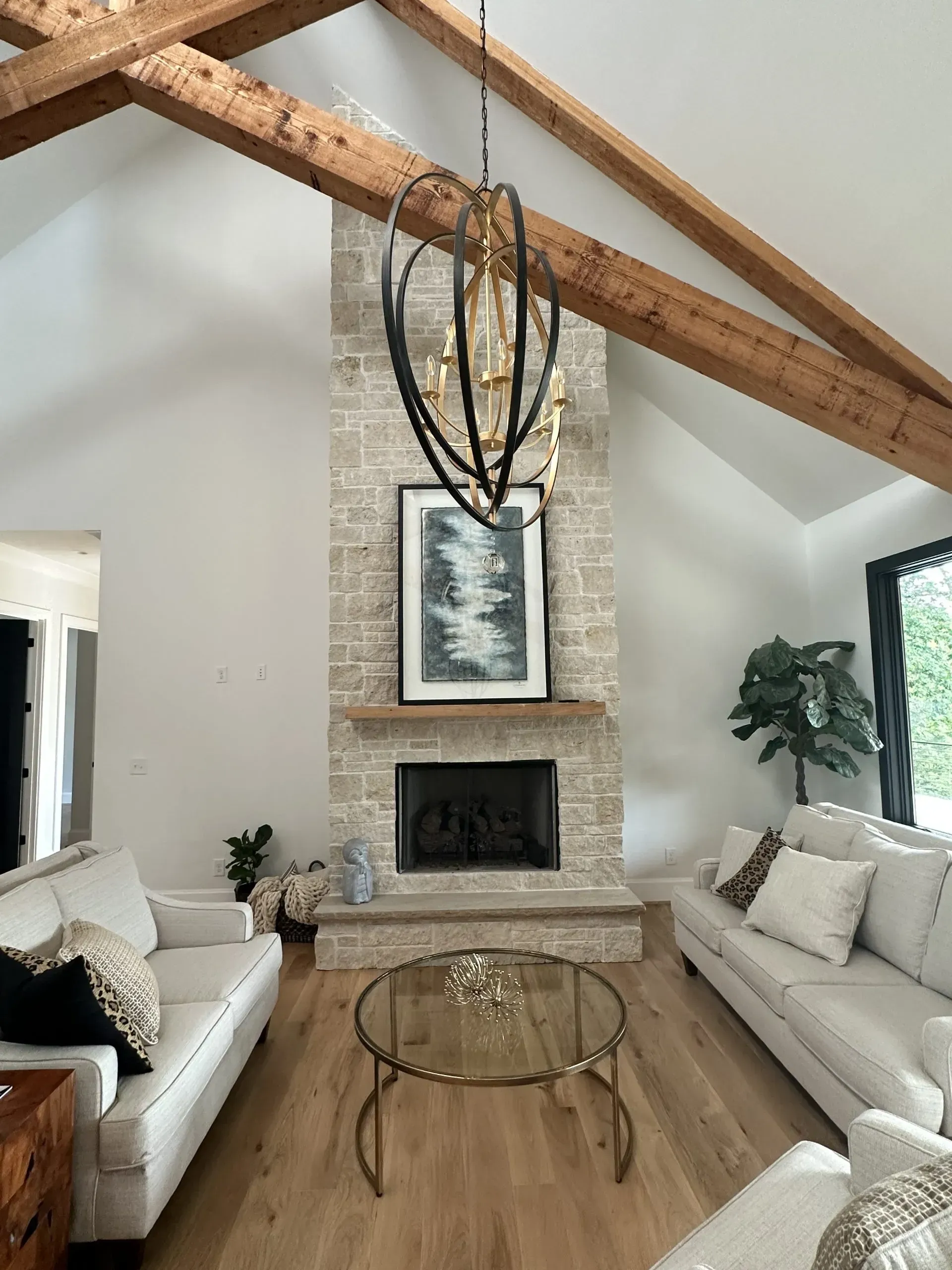 There is a fireplace in the middle of the living room.