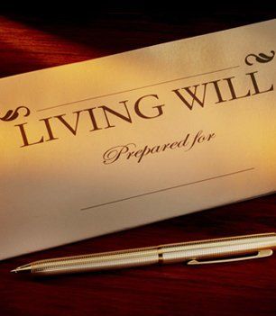 Living will and pen on wooden table