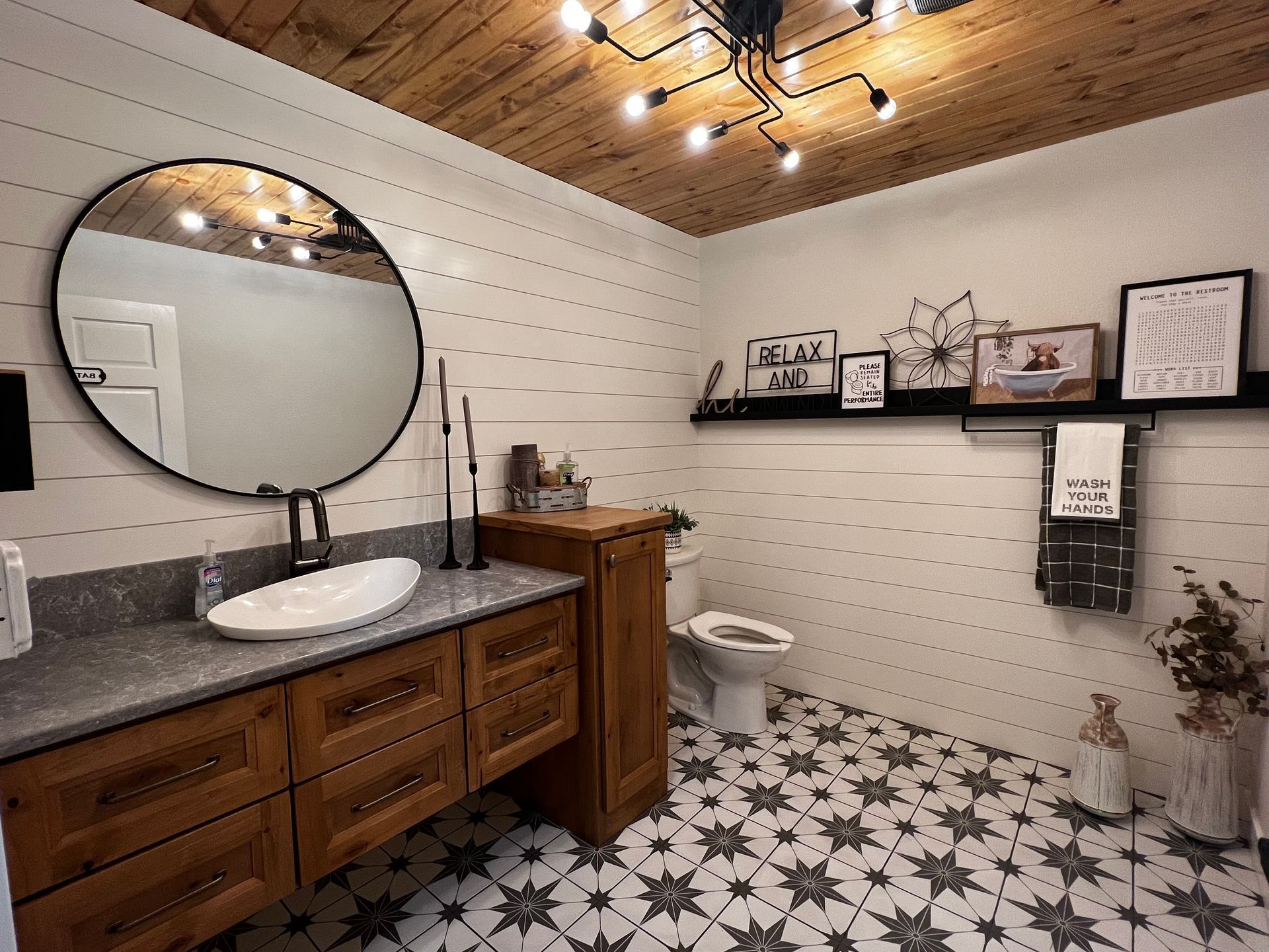 Bathroom with big circular mirror