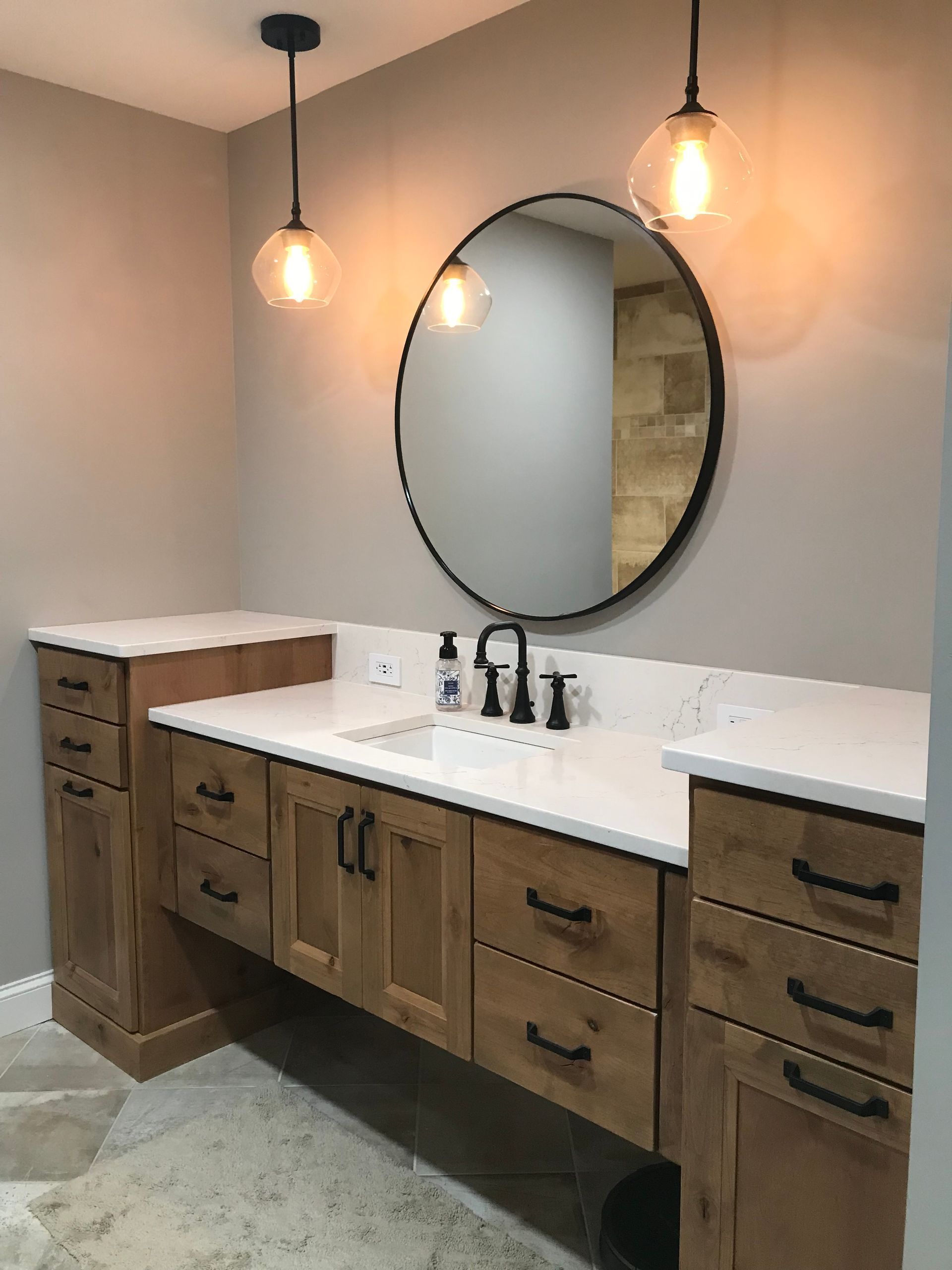 Bathroom with big circular mirror