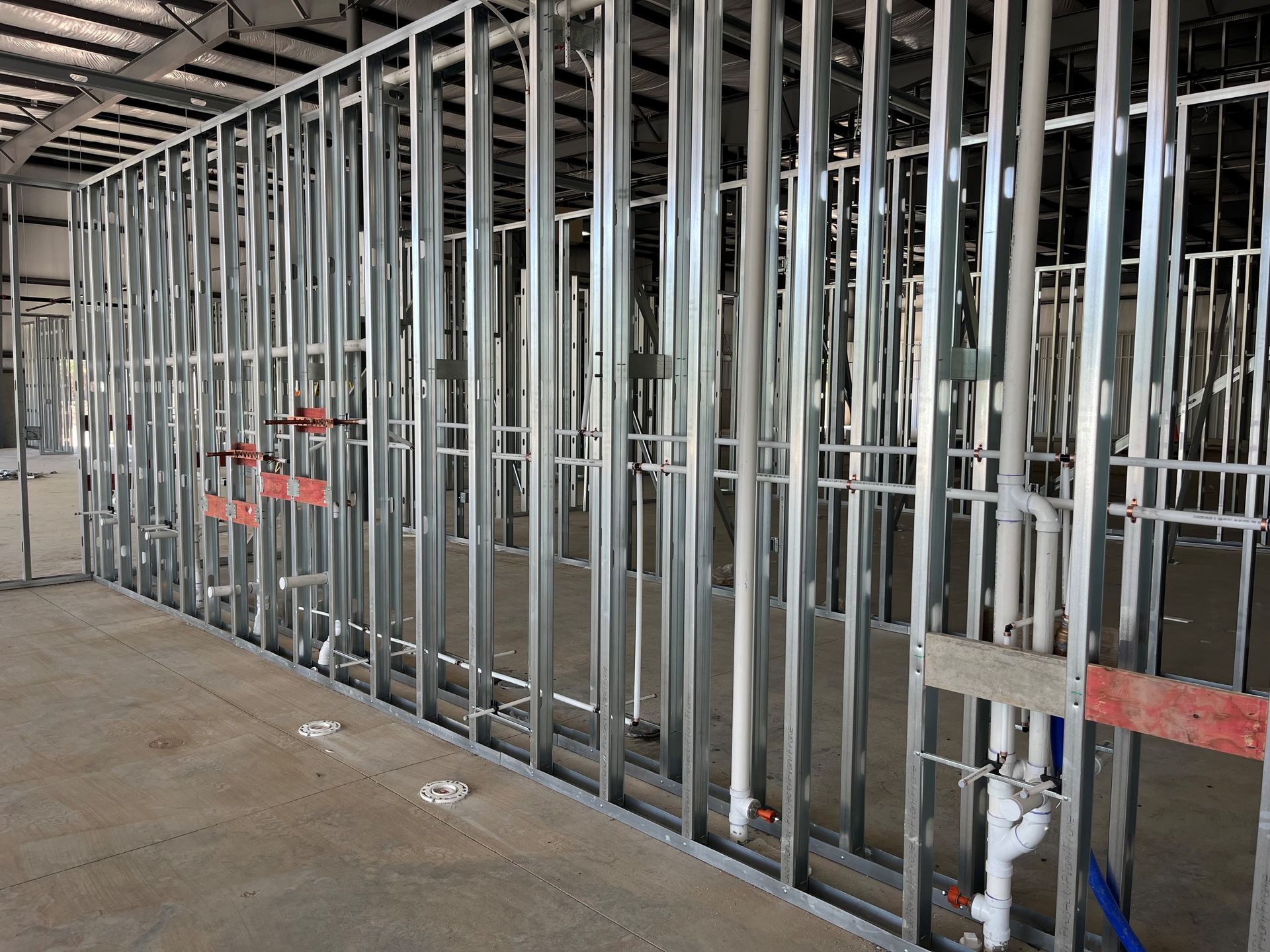 A row of metal frames in a building under construction.